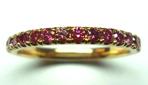 A ring set with HPHT-treated red diamonds